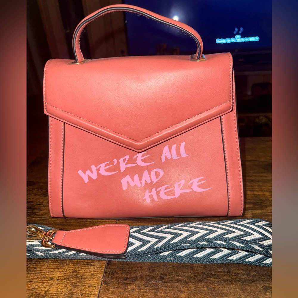 Focus Baby “we’re all mad here” coral handbag w/ woven shoulder strap